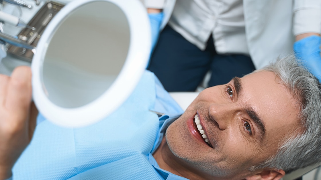 Man Smiling at Dentist